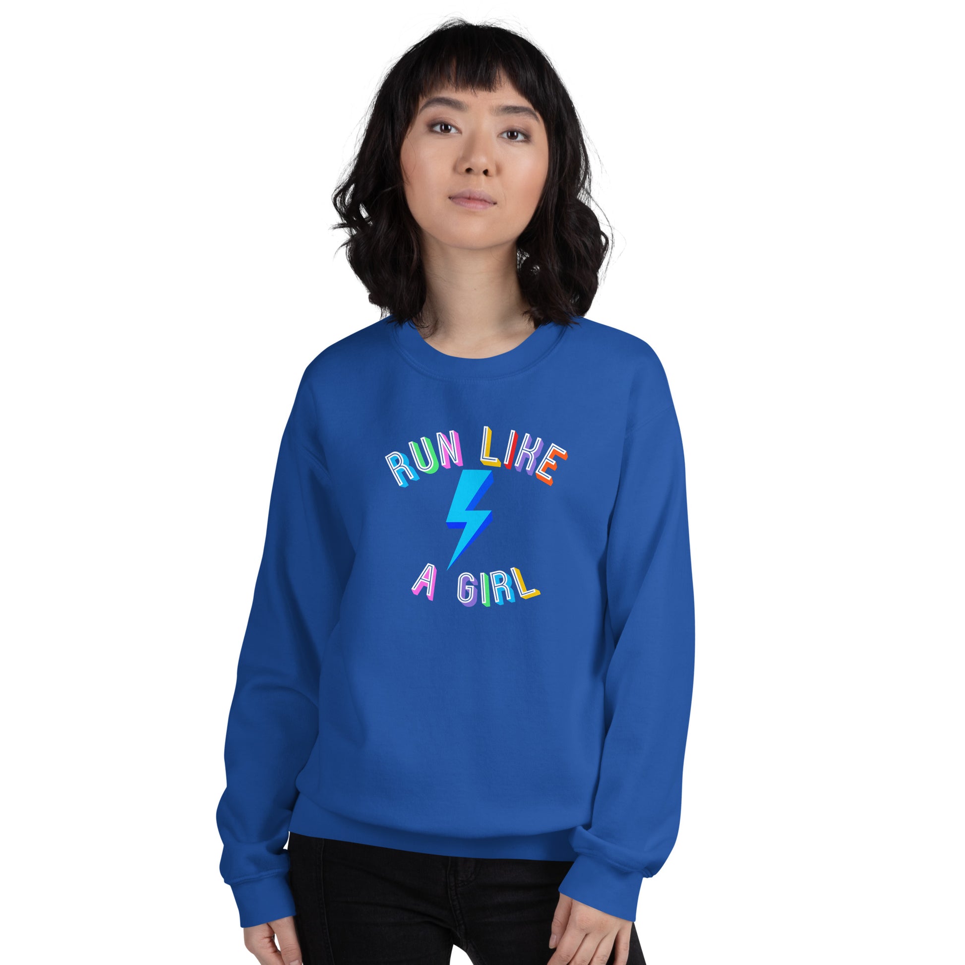 woman wearing a blue sweatshirt with the words 'run like a girl' in a rainbow coloured capital font, wrapped around a blur lightening bolt