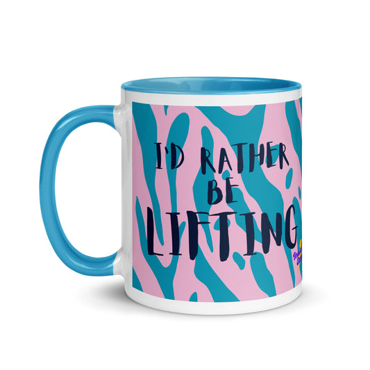 Blue handled mug with I'd rather be lifting written across a blue and pink animal print background. A gift for people who love the gym