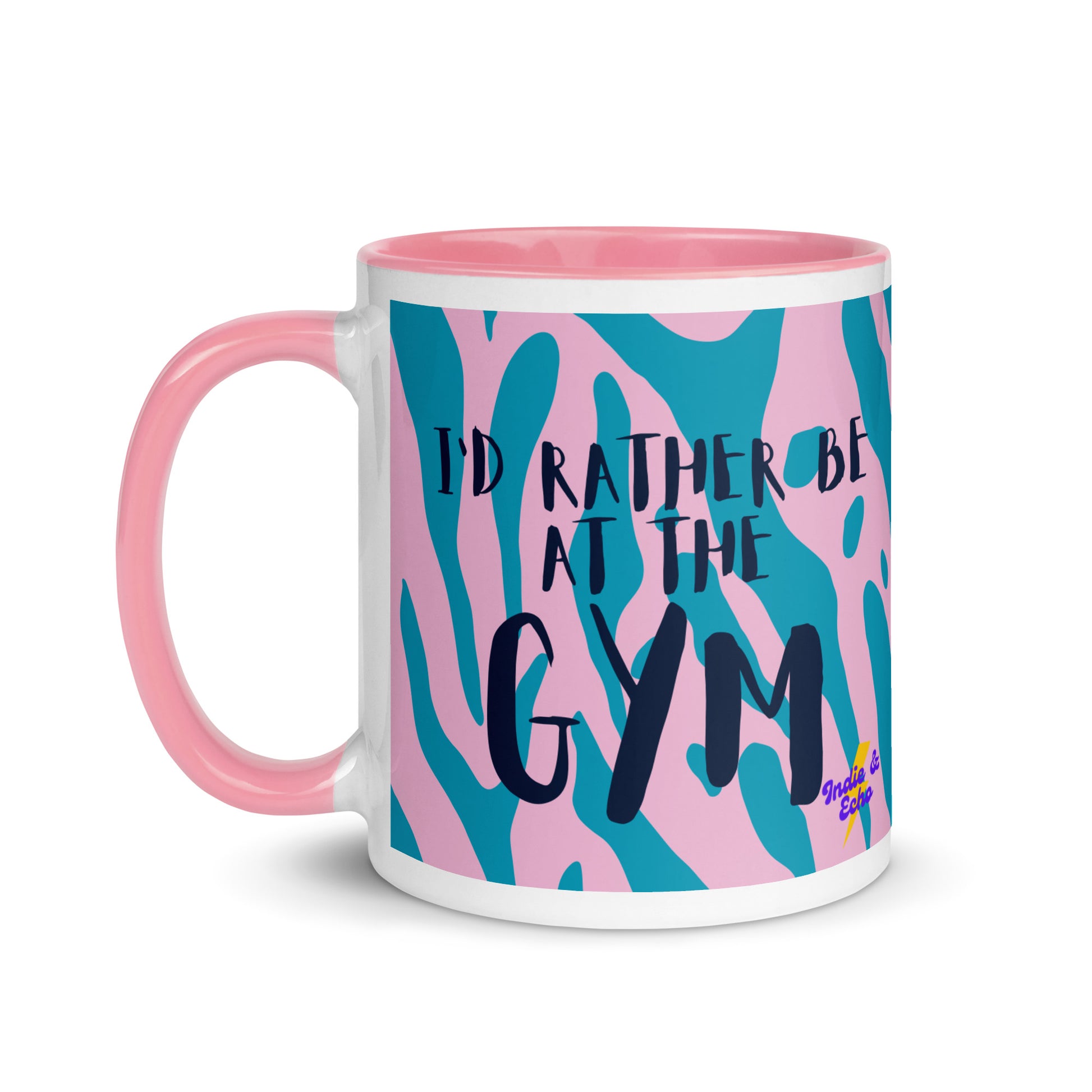 Pink handled mug with I'd rather be at the gym written on it, across a blue and pink animal print background. A gift for someone who loves the gym.