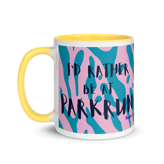 yellow handled mug with a pink and blue animal print design and the phrase I'd rather be at parkrun in a black font. the perfect gift for a runner