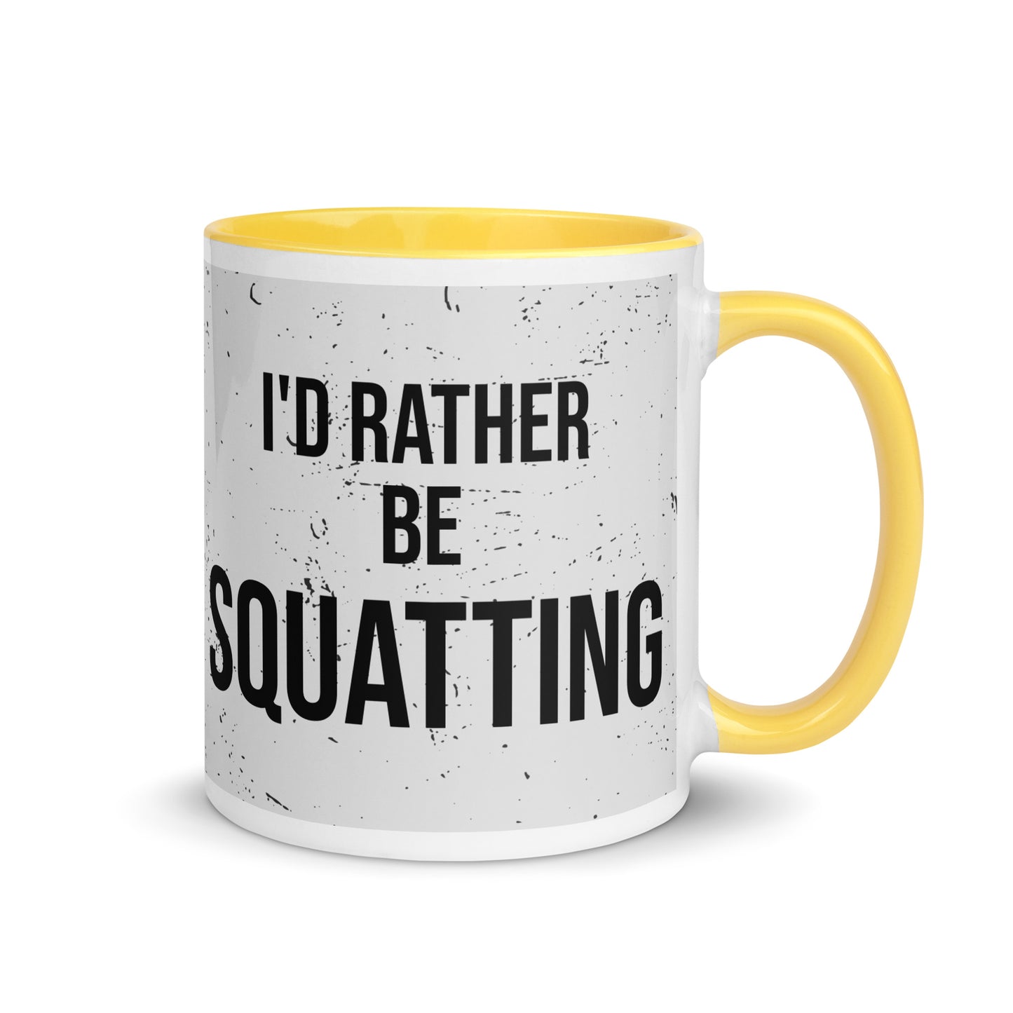 Yellow handled mug with I'd rather be squatting written on it, across a grey splatter background. A gift for someone who loves the gym.