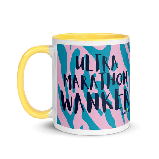 coffee mug with a yellow handle and rim, with the words ultra marathon wanker written across a pink and blue animal print background. this is a running gift for ultra marathoners.