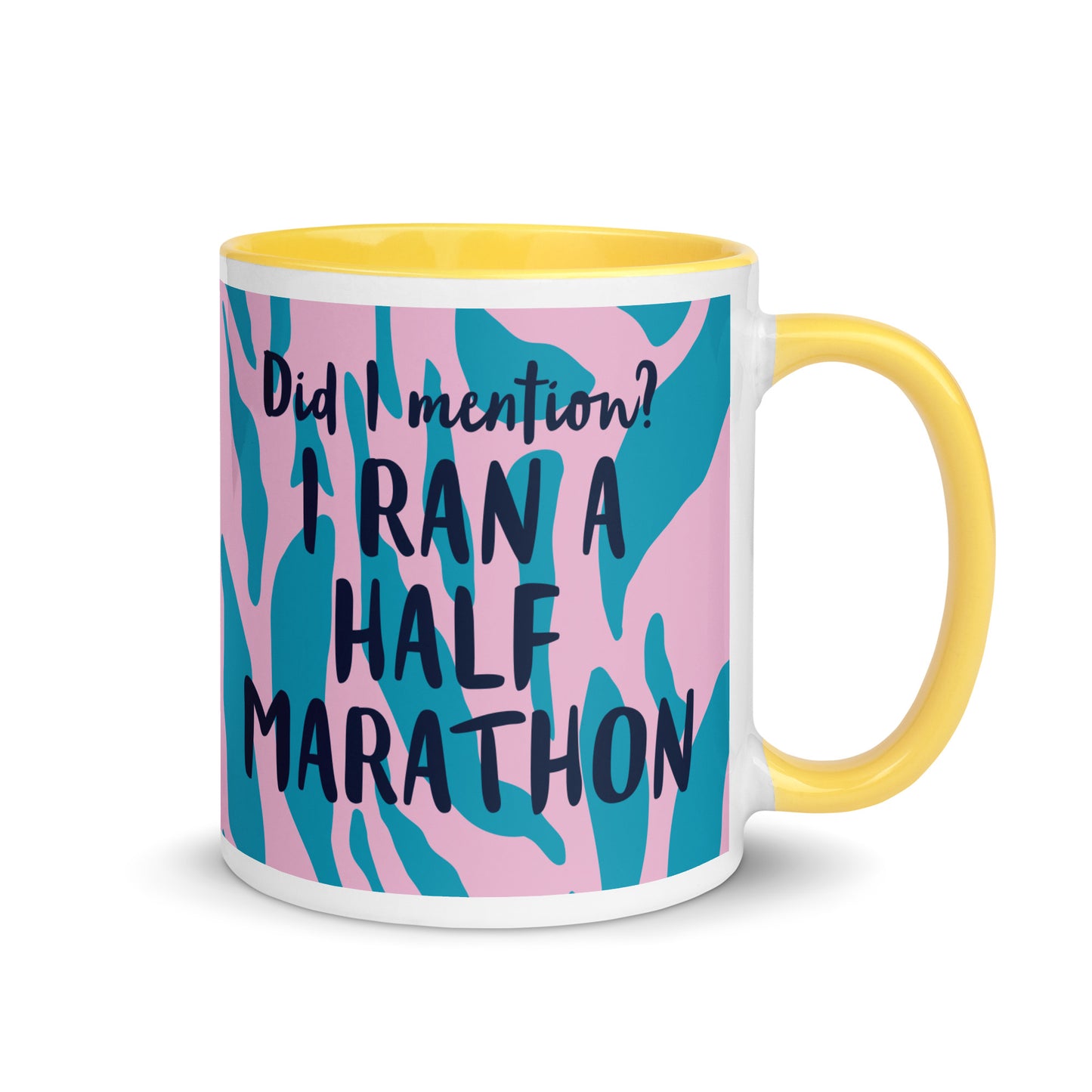 yellow handled mug with pink and blue tiger print, and the phrase did i mention? I ran a marathon in a bold font