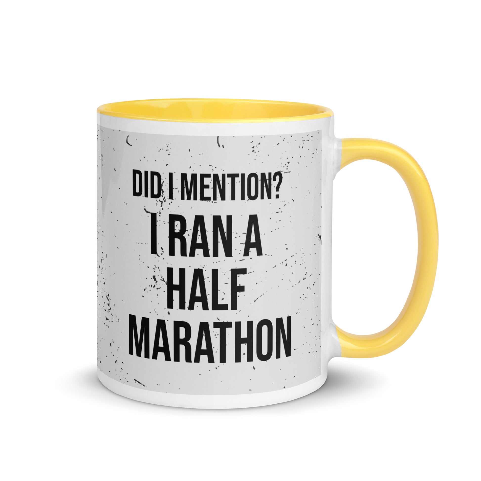 yellow handled mug with the words did I mention? I ran a half marathon in a bold font across a splatter effect background