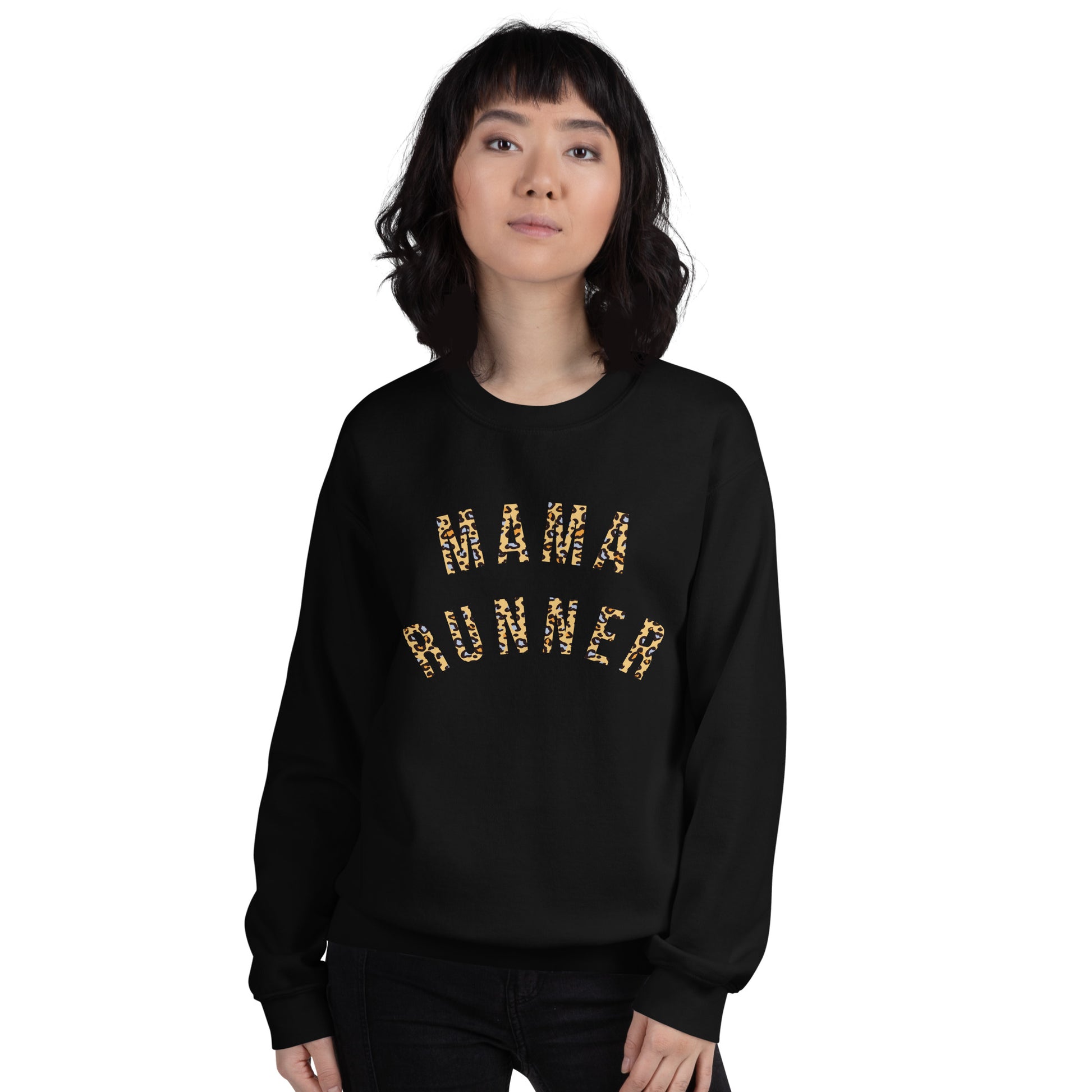 woman wearing a black sweatshirt with the words mama runner across the chest in a bold leopard print font