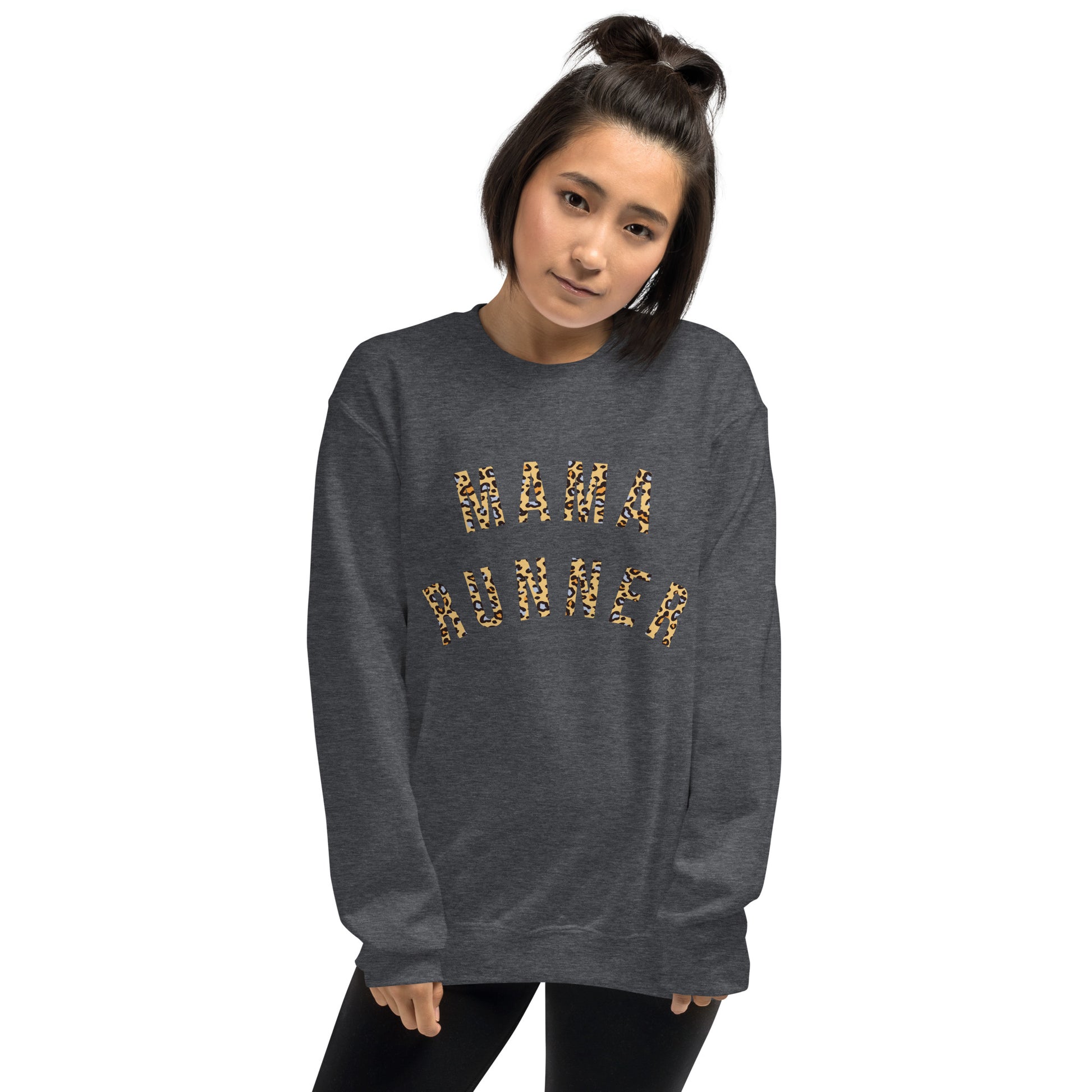 woman wearing a grey sweatshirt with the words mama runner across the chest in a bold leopard print font