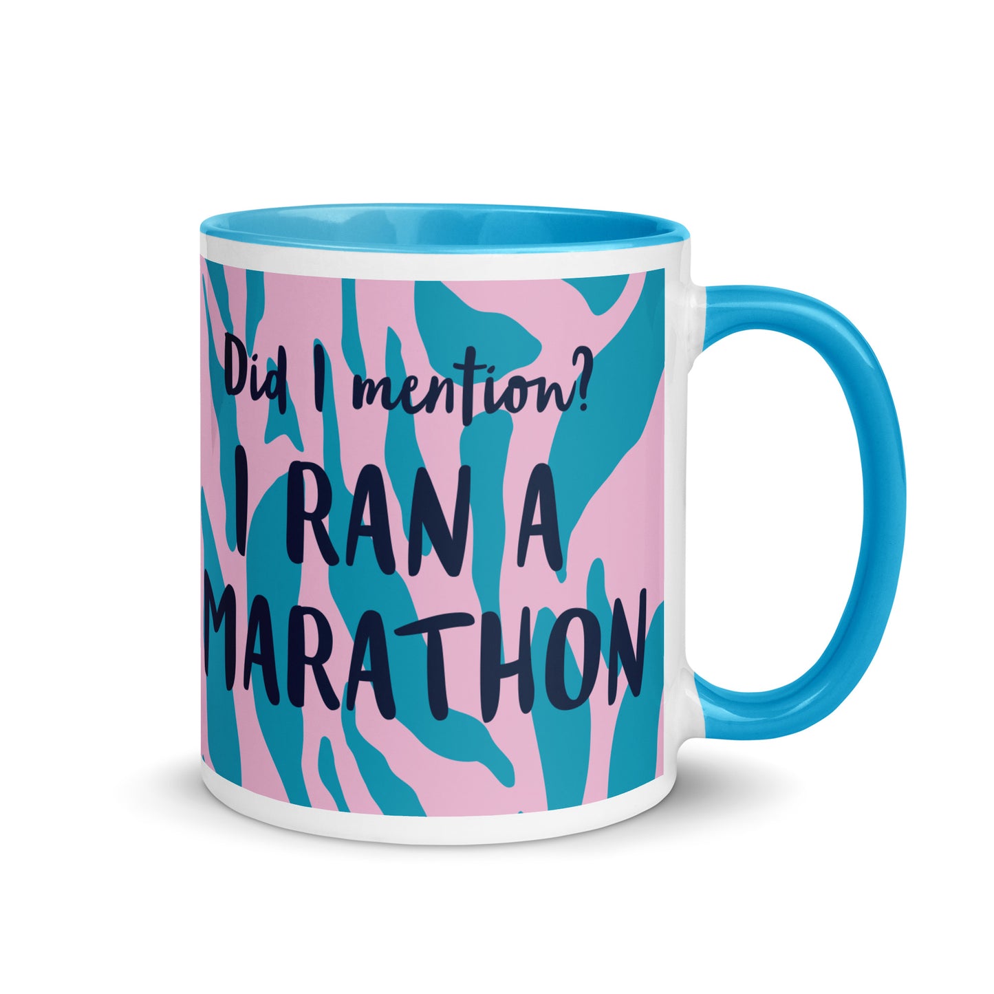 blue handled coffee mug with a pink and blue leopard print design, with the words did i mention? I ran a marathon in a bold font  