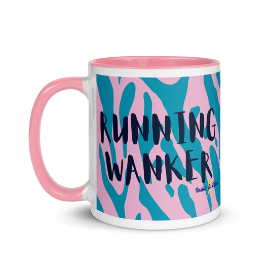 pink and white mug with running wanker in a bold capitalised font across the sides, with a pink and blue animal print background