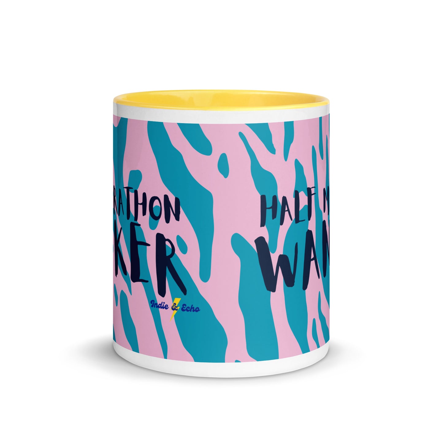 yellow and white mug with half marathon wanker written across the side, with a blue and pink animal print background
