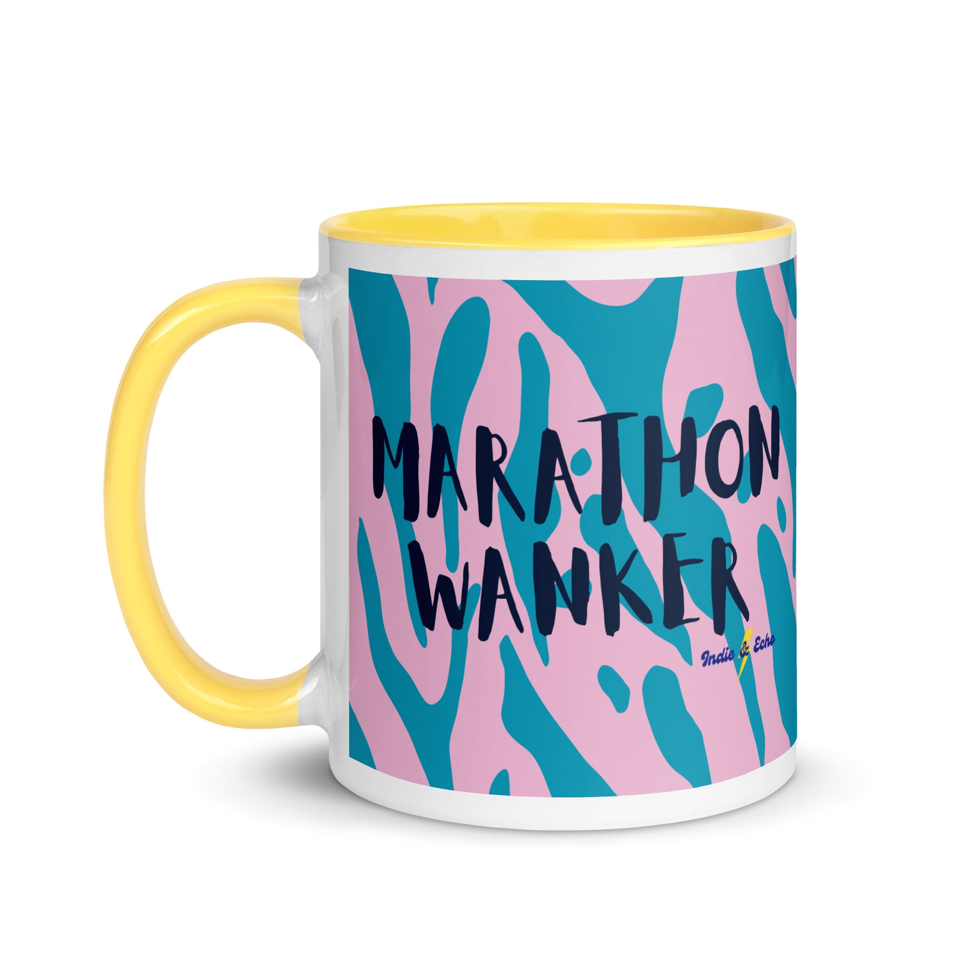 Yellow and white mug with marathon wanker in a bold, capitalised font over a blue and pink animal print background. 