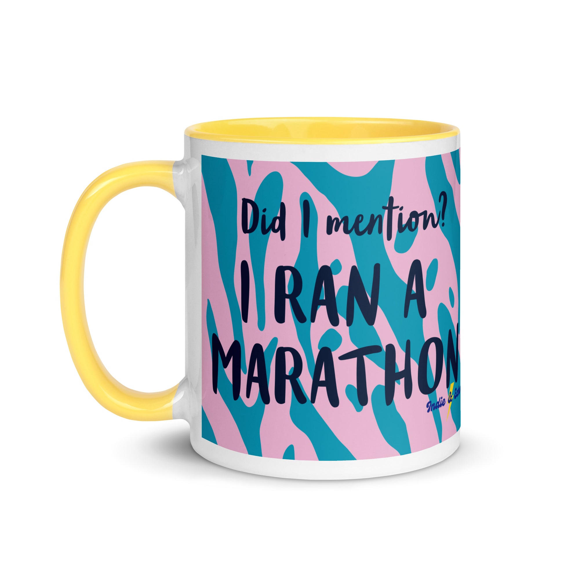yellow handled coffee mug with a pink and blue leopard print design, with the words did i mention? I ran a marathon in a bold font  