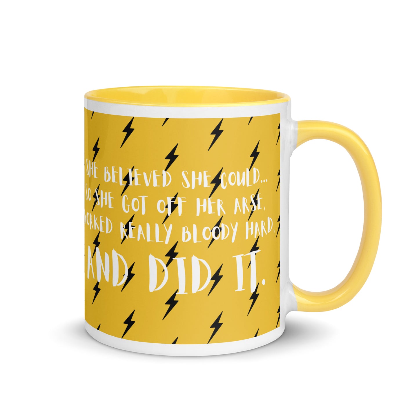 yellow mug with a black lightening bolt design, with the words she believed she could, so she got off her arse, worked really bloody hard and did it across the front in a white font.